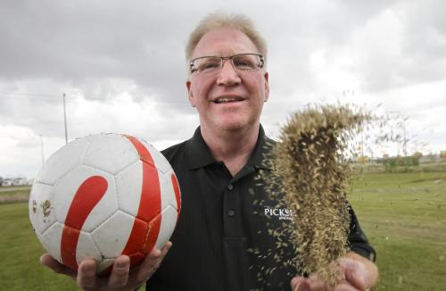 MIKE.DEAL@FREEPRESS.MB.CA 100604 - Friday, June 4th, 2010 Terry Scott with Pickseed holds some of the Manitoba grown perennial rye grass seed that was used to plant the turf at the 2010 FIFA World Cup South Africa which starts next week. MIKE DEAL / WINNIPEG FREE PRESS