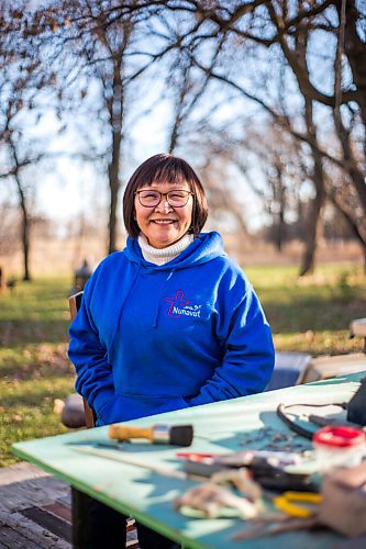 MIKAELA MACKENZIE / WINNIPEG FREE PRESS

Inuit carver Goota Ashoona, who comes from a long line of artists and whose scupture lives outside of Qaumajuq, poses for a portrait at her work bench in her yard near Elie on Tuesday, Nov. 9, 2021. For Jen story.
Winnipeg Free Press 2021.