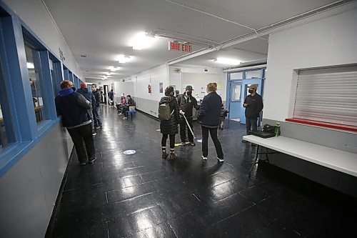 JOHN WOODS / WINNIPEG FREE PRESS
Trish Buhler, hockey mum and manager of St Boniface Seals, scans the vaccination card of people as they enter the Bertrand Arena on Tuesday, November 9, 2021. Shaun Chornley, the president of the St Boniface Minor Hockey Association, and others feel that using volunteers to scan vaccination cards at city arenas is risky.

Re: Pursaga