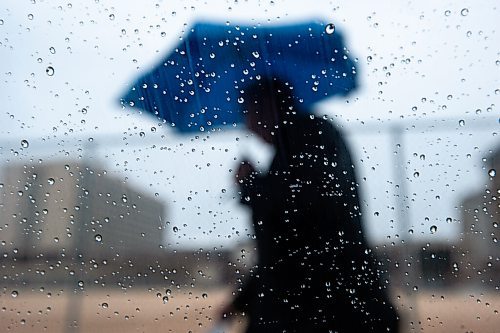 Mike Sudoma / Winnipeg Free Press
A man wielding an umbrella makes his way down Princess St as Wednesday afternoons rain starts to turn into snow.
November 10, 2021