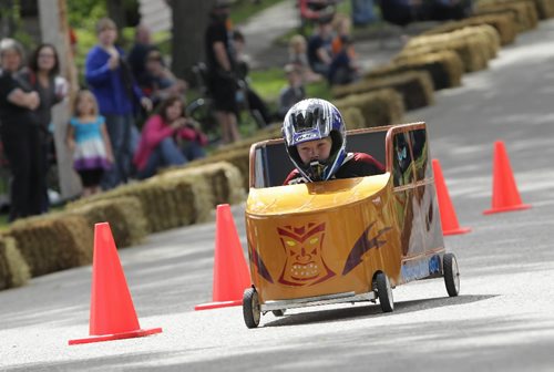 Brandon Sun 05062010 Connor Madill races down Rideau St. during a heat at the Kiwanis Kar Derby on Saturday. (Tim Smith/Brandon Sun)