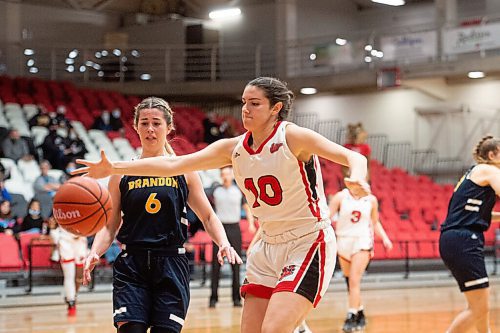 Mike Sudoma / Winnipeg Free Press
Wesmen forward, Jessica Van Dyck, keeps the ball in bounds as they take on the University of Brandon Bobcats at the Duckworth Centre at University of Winnipeg Thursday night
November 10, 2021