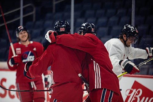 JESSICA LEE / WINNIPEG FREE PRESS

Nate Schmidt, Dylan DeMelo, and Blake Wheeler celebrate at Canada Life Centre during practice on November 12, 2021 after making a goal.








