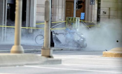 BORIS.MINKEVICH@FREEPRESS.MB.CA  100606 BORIS MINKEVICH / WINNIPEG FREE PRESS Police bomb squad blow up a suspicous suitcase at Portage and Garry.