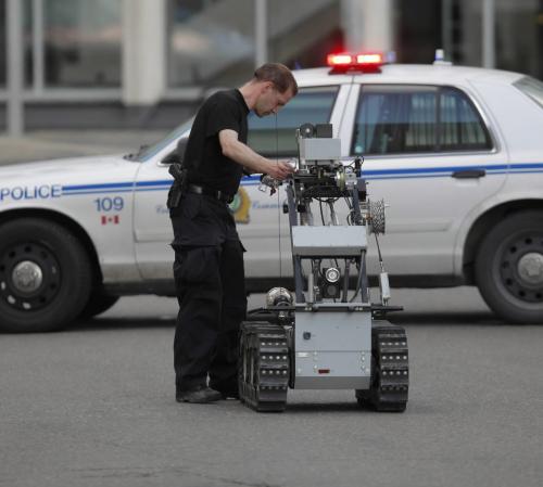 BORIS.MINKEVICH@FREEPRESS.MB.CA  100606 BORIS MINKEVICH / WINNIPEG FREE PRESS Police bomb squad get's Dean the robot ready to blow up a suspicous suitcase at Portage and Garry.