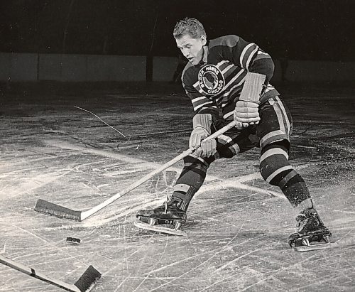 Canstar Community News Billy Mosienko cuts sharply into the ice as he makes a move on a defender.