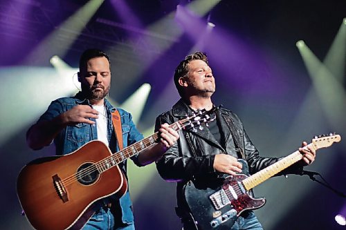 Canstar Community News Nov. 5, 2021 - Dave Wasyliw, (left) and Chris Thorsteinson of Doc Walker took to the Club Regent live stage for the first time since 2019. Playing to a near sellout crowd, the Portage La Prairie duo entertained fans with performances of their many hit singles including Beautiful Life, The Show Is Free, That's All and a tribute to the 20th anniversary of their album Curve with a crowd boosted version of Rocket Girl. (JOSEPH BERNACKI/CANSTAR COMMUNITY NEWS/HEADLINER)
