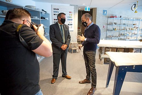 MIKE DEAL / WINNIPEG FREE PRESS
Stephen Borys (right), WAG-Qaumajuq Director and CEO along with Cliff Cullen (left), Minister of Education, celebrates the opening of the new, fully renovated WAG Studio.
211116 - Tuesday, November 16, 2021.