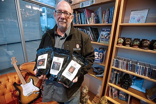 JOHN WOODS / WINNIPEG FREE PRESS
Robert Young, owner of Writers & Rockers Coffee Company, shows off some of his labels at Radiance Gifts in Winnipeg on Tuesday, November 16, 2021. Young has partnered with some canadian bands and sells his products at Radiance Gifts.

Re: ?