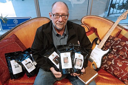 JOHN WOODS / WINNIPEG FREE PRESS
Robert Young, owner of Writers & Rockers Coffee Company, shows off some of his labels at Radiance Gifts in Winnipeg on Tuesday, November 16, 2021. Young has partnered with some canadian bands and sells his products at Radiance Gifts.

Re: ?