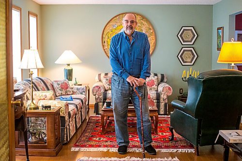 MIKAELA MACKENZIE / WINNIPEG FREE PRESS

Max Johnson poses for a portrait in his home after coming back from Lithuania, where he went to get knee surgery, in Winnipeg on Wednesday, Nov. 17, 2021. For Kevin story.
Winnipeg Free Press 2021.