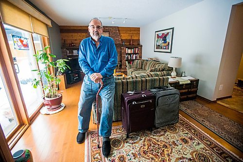 MIKAELA MACKENZIE / WINNIPEG FREE PRESS

Max Johnson poses for a portrait in his home (with the suitcases from travelling) after coming back from Lithuania, where he went to get knee surgery, in Winnipeg on Wednesday, Nov. 17, 2021. For Kevin story.
Winnipeg Free Press 2021.