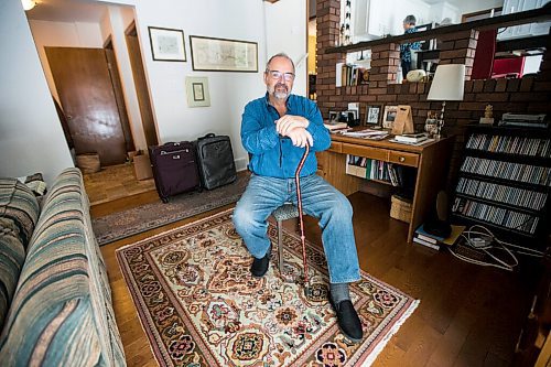 MIKAELA MACKENZIE / WINNIPEG FREE PRESS

Max Johnson poses for a portrait in his home (with the suitcases from travelling) after coming back from Lithuania, where he went to get knee surgery, in Winnipeg on Wednesday, Nov. 17, 2021. For Kevin story.
Winnipeg Free Press 2021.