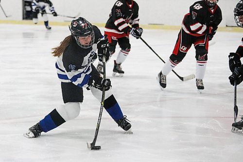 Daniel Crump / Winnipeg Free Press. A College Jeanne-Suave player [77 not on game sheet] shoots the puck. Winnipeg Womens High School Hockey League hockey Jeanne-Suave Olympiens vs. Beliveau Barracudas at the Southdale Arena in Winnipeg. November 17, 2021.