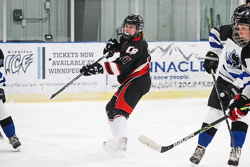 Daniel Crump / Winnipeg Free Press. Beliveaus Maisie Duffin (17) plays the puck. Winnipeg Womens High School Hockey League hockey Jeanne-Suave Olympiens vs. Beliveau Barracudas at the Southdale Arena in Winnipeg. November 17, 2021.