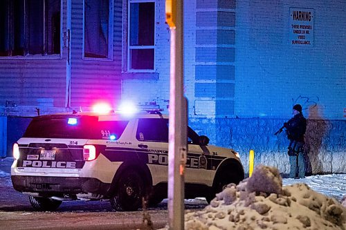 Daniel Crump / Winnipeg Free Press. Winnipeg police, including the tactical unit, surround 363 Mountain Avenue following an incident. An area of Mountain Avenue is blocked off between Salter Street and Aikins Street. November 17, 2021.
