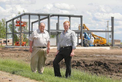 Brandon Sun Farm Genesis president Keith Hannah, left, and marketing director Markus Schmülgen stand in front of their new hemp food production facility currently being constructed. FOR BILL REDEKOP (Bruce Bumstead/Brandon Sun)