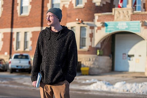 MIKAELA MACKENZIE / WINNIPEG FREE PRESS

Free Press reporter Ryan Thorpe poses for a portrait in front of the Minto Armoury, where Patrik Mathews was at one point stationed, in Winnipeg on Friday, Nov. 19, 2021. For Ryan Thorpe story.
Winnipeg Free Press 2021.