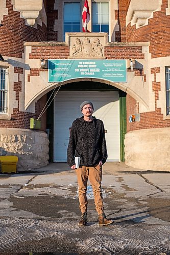 MIKAELA MACKENZIE / WINNIPEG FREE PRESS

Free Press reporter Ryan Thorpe poses for a portrait in front of the Minto Armoury, where Patrik Mathews was at one point stationed, in Winnipeg on Friday, Nov. 19, 2021. For Ryan Thorpe story.
Winnipeg Free Press 2021.