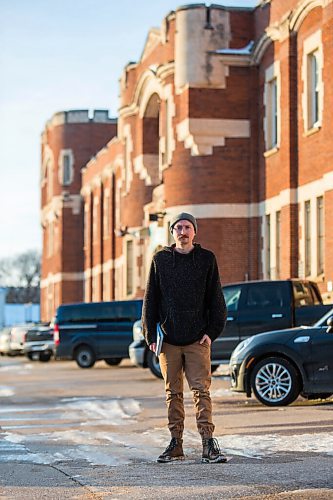 MIKAELA MACKENZIE / WINNIPEG FREE PRESS

Free Press reporter Ryan Thorpe poses for a portrait in front of the Minto Armoury, where Patrik Mathews was at one point stationed, in Winnipeg on Friday, Nov. 19, 2021. For Ryan Thorpe story.
Winnipeg Free Press 2021.