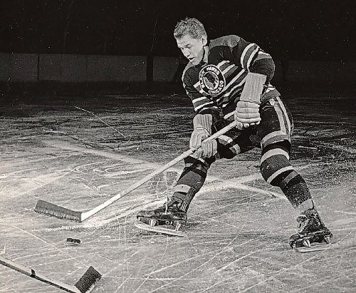 Canstar Community News Billy Mosienko cuts sharply into the ice as he makes a move on a defender.