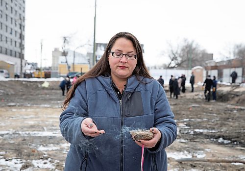 JESSICA LEE / WINNIPEG FREE PRESS

Jamie Grasby, a knowledge keeper, blesses the site at 390 Ross Ave by smudging on November 22, 2021. Home First Winnipeg Inc is building a 47-unit apartment for those at risk of becoming homeless.

