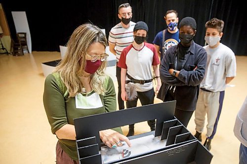 MIKE DEAL / WINNIPEG FREE PRESS
Director, Kelly Thornton holds a miniature version of the stage and tries to describe how the movement of the 24-foot revolve will affect how the actors move about on stage, during rehearsal at MTC Thursday morning. The actors (from left) Simon Bracken, Em Siobhan McCourt, Simon Miron, Ivy Charles and Breton Lalama.
A behind-the-scene look at the Royal Manitoba Theatre Company's production of Orlando a play by Virginia Woolf and adapted by Sarah Ruhl, which is running from November 25 - December 18.
See Alan Small story
211028 - Thursday, October 28, 2021.