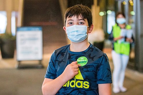 MIKAELA MACKENZIE / WINNIPEG FREE PRESS

Drew Robert poses for a portrait in front of the RBC Convention Centre vaccination supersite after getting vaccinated in Winnipeg on Wednesday, Nov. 24, 2021. For --- story.
Winnipeg Free Press 2021.