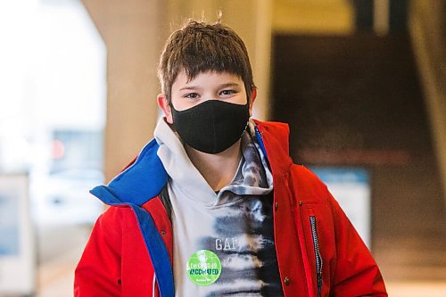 MIKAELA MACKENZIE / WINNIPEG FREE PRESS

Jacob Clark (ten) poses for a portrait in front of the RBC Convention Centre vaccination supersite after getting vaccinated in Winnipeg on Wednesday, Nov. 24, 2021. For --- story.
Winnipeg Free Press 2021.