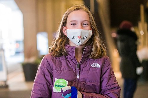 MIKAELA MACKENZIE / WINNIPEG FREE PRESS

Madison Brown (ten) poses for a portrait in front of the RBC Convention Centre vaccination supersite after getting vaccinated in Winnipeg on Wednesday, Nov. 24, 2021. For --- story.
Winnipeg Free Press 2021.