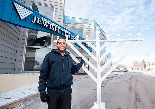 Mike Sudoma / Winnipeg Free Press
Rabbi Boruch Heidingsfeld shows off awooden menorah in front of the Chabad Jewish Learning Centre Wednesday afternoon. The menorah will be strapped into the back of a truck Sunday evening to use for the Chabad Jewish Learning Centres Mobile Menorah service, which runs from November 28 until December 6.
November 24, 2021