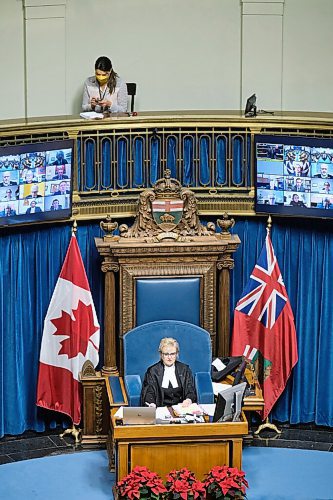 MIKE DEAL / WINNIPEG FREE PRESS
Winnipeg Free Press reporter Danielle Da Silva sits in the Press Gallery behind the Speaker of the Legislative Assembly of Manitoba, Myrna Driedger, as she delivers the first-ever instance of a land acknowledgement as part of the formal proceedings of the legislative assembly of Manitoba Monday afternoon.
211129 - Monday, November 29, 2021.