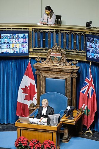 MIKE DEAL / WINNIPEG FREE PRESS
Winnipeg Free Press reporter Danielle Da Silva sits in the Press Gallery behind the Speaker of the Legislative Assembly of Manitoba, Myrna Driedger, as she delivers the first-ever instance of a land acknowledgement as part of the formal proceedings of the legislative assembly of Manitoba Monday afternoon.
211129 - Monday, November 29, 2021.