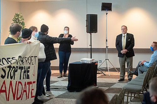 Mike Sudoma / Winnipeg Free Press
Student representatives hold up a sign reading Profs Over Profit. Stop The Mandate while voicing concerns over educational finances and the current University of Manitoba Strike in the midst of Finance Minister, Scott Fieldings 2022 Budget Consultation at the RBC Convention Centre Monday evening.
November 29, 2021