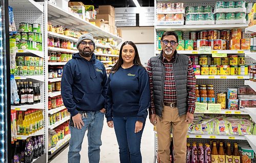 JESSICA LEE / WINNIPEG FREE PRESS

Dinu Tailor (right), owner of Dinos Grocery Mart, is photographed at his store with daughter Neeti Varma and son-in-law Rajan Varma on November 30, 2021.

Reporter: Dave














