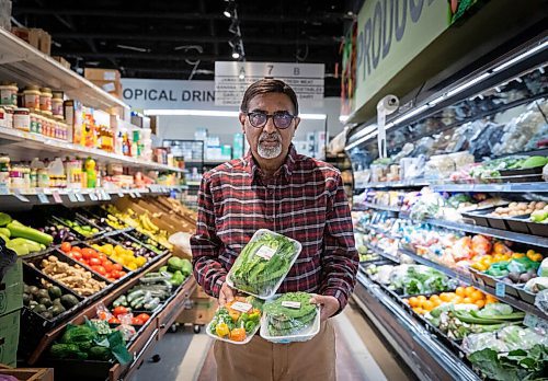 JESSICA LEE / WINNIPEG FREE PRESS

Dinu Tailor, owner of Dinos Grocery Mart, is photographed at his store holding specialty produce items on November 30, 2021.

Reporter: Dave













