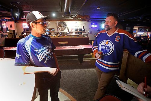 JOHN WOODS / WINNIPEG FREE PRESS
Patrick Nikolaus, left, and Mark Lamoreux talk about their friend at a memorial gathering for Tyler Yarema at the Pandora Inn in Winnipeg on Tuesday, November 30, 2021. Yarema is the citys latest homicide.

Re: May
