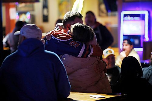 JOHN WOODS / WINNIPEG FREE PRESS
Friends support each other at a memorial gathering for Tyler Yarema at the Pandora Inn in Winnipeg on Tuesday, November 30, 2021. Yarema is the citys latest homicide.

Re: May