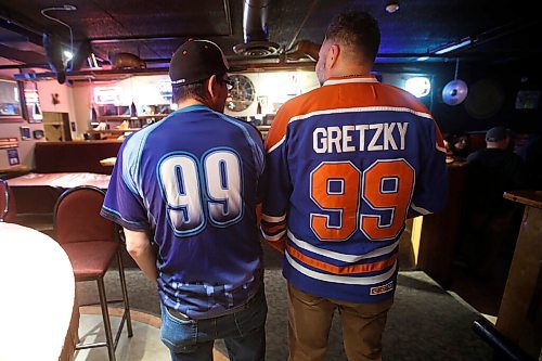 JOHN WOODS / WINNIPEG FREE PRESS
Patrick Nikolaus, left, and Mark Lamoreux the number of their friend at a memorial gathering for Tyler Yarema at the Pandora Inn in Winnipeg on Tuesday, November 30, 2021. Yarema is the citys latest homicide.

Re: May