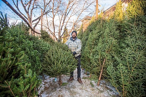 MIKAELA MACKENZIE / WINNIPEG FREE PRESS

Robin Bryan poses for a portrait with Christmas trees at Pete's Trees in Winnipeg on Friday, Dec. 3, 2021. For Martin Cash story.
Winnipeg Free Press 2021.