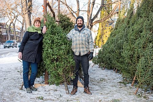 MIKAELA MACKENZIE / WINNIPEG FREE PRESS

Raia Bryan and her brother, Robin Bryan, pose for a portrait with Christmas trees at Pete's Trees in Winnipeg on Friday, Dec. 3, 2021. For Martin Cash story.
Winnipeg Free Press 2021.