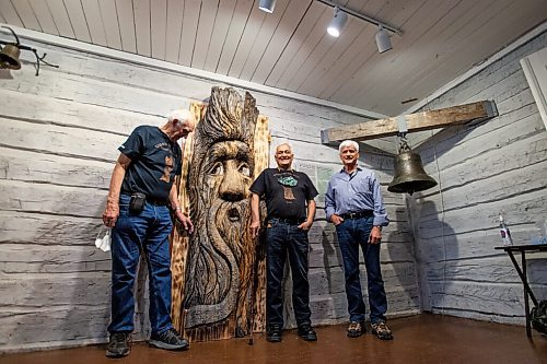 Daniel Crump / Winnipeg Free Press. (L to R) Walter Mirosh, Robert Leclair, who are the original carvers of Woody-Mhitikm and Marcel Ritchot, who restored Woody and helped find the spirit tree from Bois-des-Esprits forest a new home/exhibit at Le Musée de Saint-Boniface Museum. December 4, 2021.