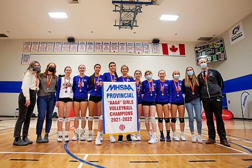 Daniel Crump / Winnipeg Free Press. The  JH Bruns Broncos girls volleyball teams poses for a team photo after defeating the St. Marys Flames to win the AAAA Provincial High School Girls Volleyball championships at Sturgeon Heights Collegiate in Winnipeg, Saturday evening. December 4, 2021.