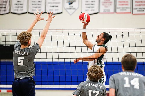 Daniel Crump / Winnipeg Free Press. Vincent Massey Trojans middle Udhay Chatha tips the ball during the AAAA Provincial High School Boys Volleyball championships against the Westgate Wings at Sturgeon Heights Collegiate in Winnipeg, Saturday evening. December 4, 2021.