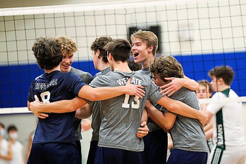 Daniel Crump / Winnipeg Free Press. The Westgate Wings celebrate a point during the AAAA Provincial High School Boys Volleyball championships against the Vicent Massey Trojans at Sturgeon Heights Collegiate in Winnipeg, Saturday evening. December 4, 2021.