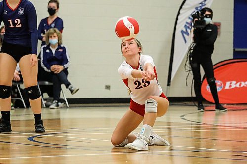 Daniel Crump / Winnipeg Free Press. St. Marys Flames libero Ava Skromeda digs for the ball during the AAAA Provincial High School Girls Volleyball championships between against the JH Bruns Broncos at Sturgeon Heights Collegiate in Winnipeg, Saturday evening. December 4, 2021.