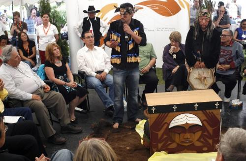 MIKE.DEAL@FREEPRESS.MB.CA 100616 - Wednesday, June 16th, 2010 Participants in the Commissioners' Sharing Circle at the Truth and Reconciliation ceremonies at The Forks. Artist Luke Marston from BC Coast  Salish Nation talks about the cedar box he made for the sharing circle. MIKE DEAL / WINNIPEG FREE PRESS