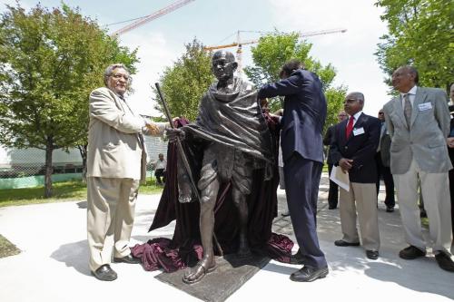 MIKE.DEAL@FREEPRESS.MB.CA 100616 - Wednesday, June 16th, 2010 (l-r) Naranjan Dhalla and Shashishekhar Gavai unveil the statue of Mahatma Gandhi that was donated by the Government of India for the Canadian Museum of Human Rights at a ceremony held on the grounds at The Forks. MIKE DEAL / WINNIPEG FREE PRESS