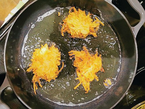 Canstar Community News Latkes are a traditional treat during Hanukkah, the Jewish festival of lights.