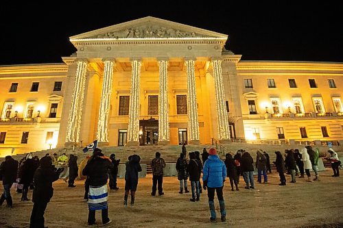 Mike Sudoma / Winnipeg Free Press
A small crowd gathers at the Manitoba Legislative building Monday evening to take part in the Rally for Remembrance, to raise awareness of gender based violence and to remember those lost to gender based violence.
December 6, 2021